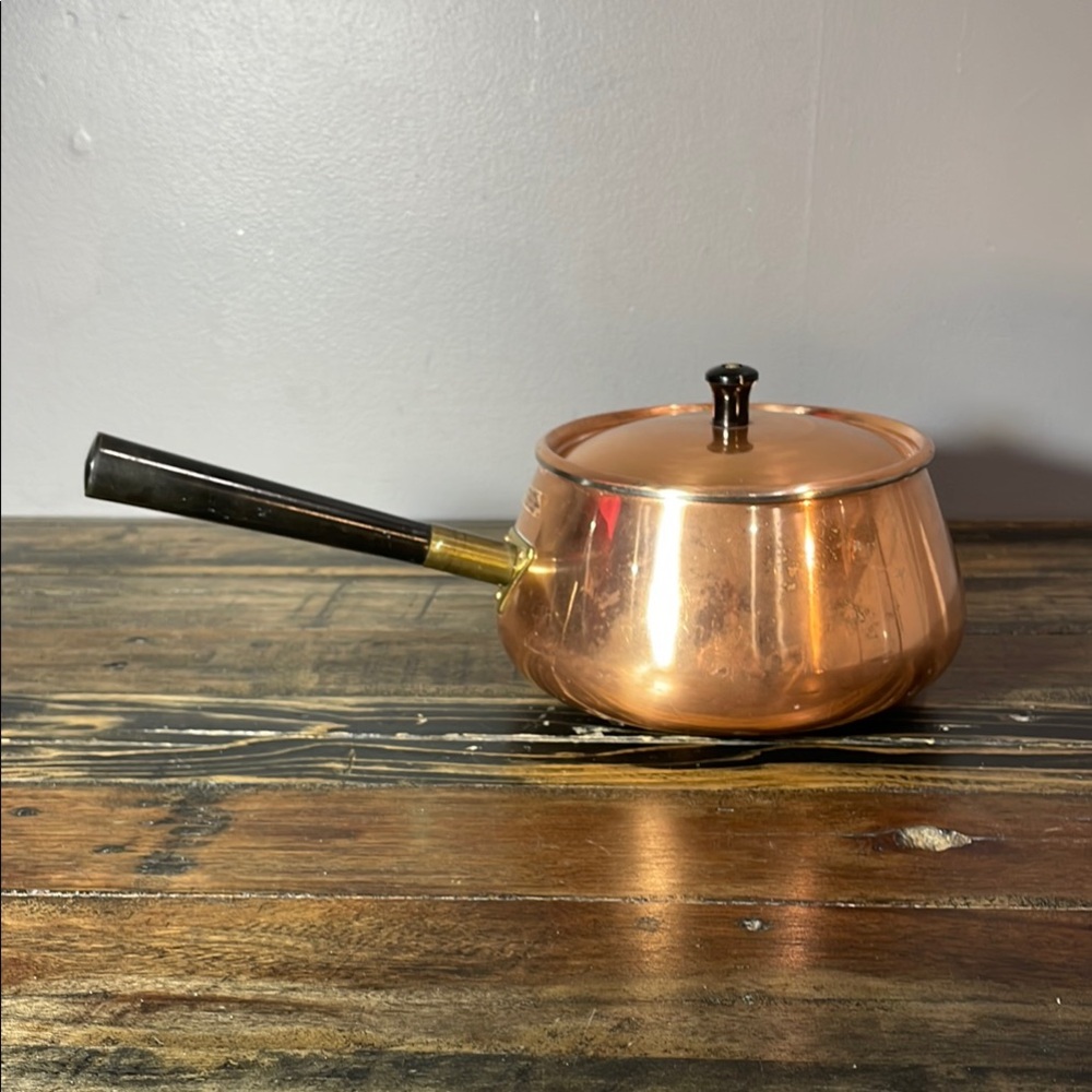 Beautiful copper and brass pot with lid made in Korea
Benjamin & Medwin Inc. NYC
